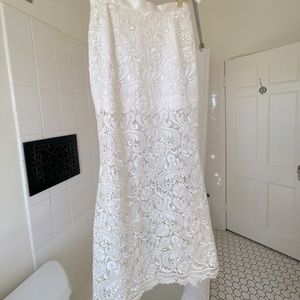 Floor length custom white lace mermaid shaped skirt.
